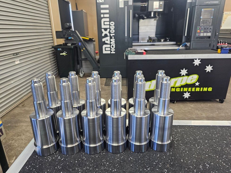 Machined metal parts near Maxmill machine, Engineering Cnc Mach for projects.