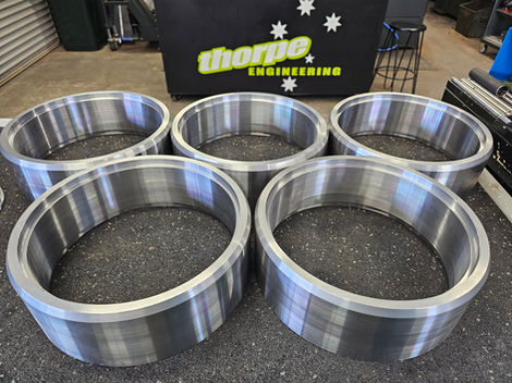 Thorpe Engineering, five Precision Components metal rings in the workshop, Engineering Cnc Mach.