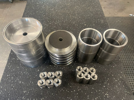 Metal machined parts arrangement, various shapes, background of a workshop Engineering Cnc Mach