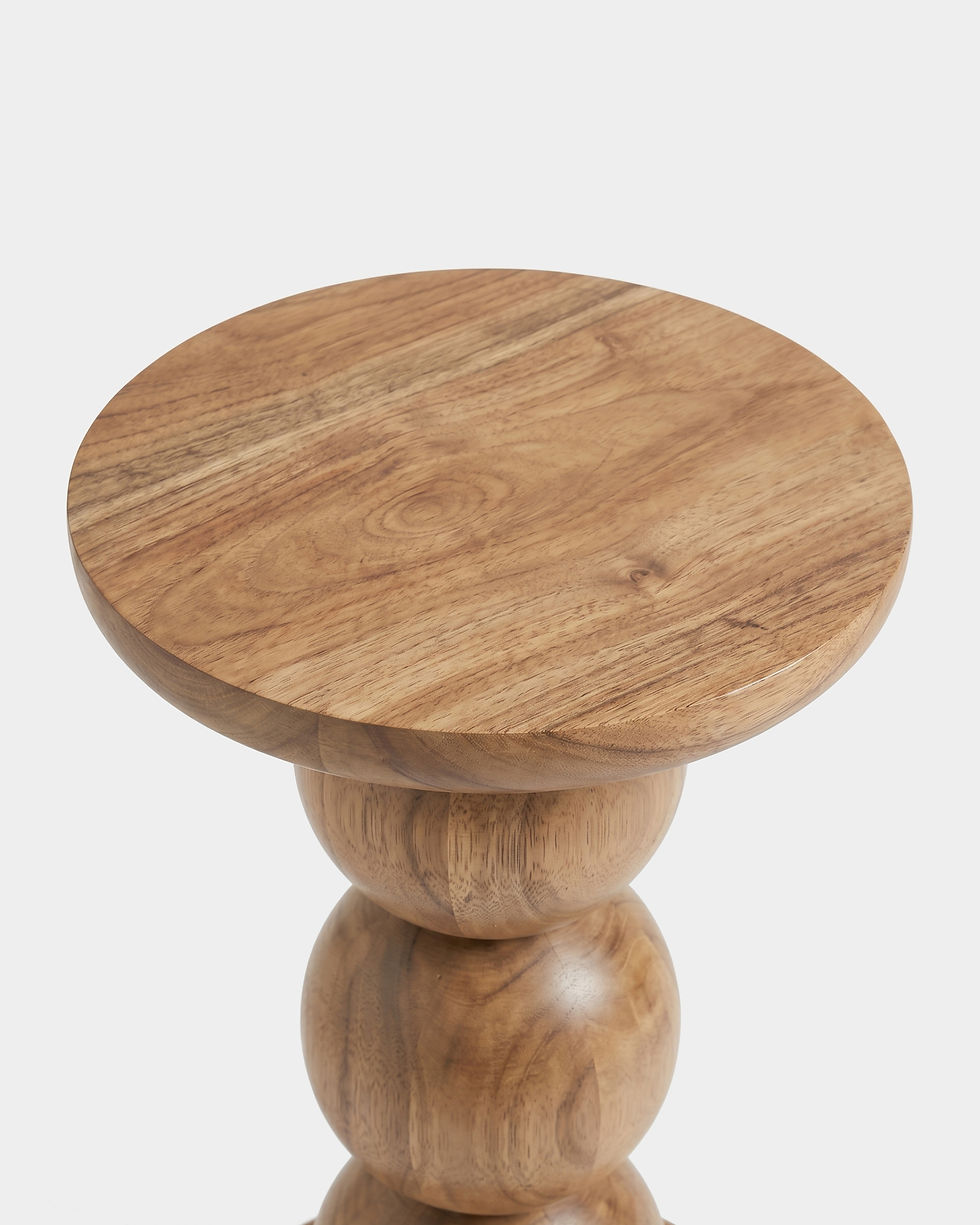 Top view of a round solid wood side table.