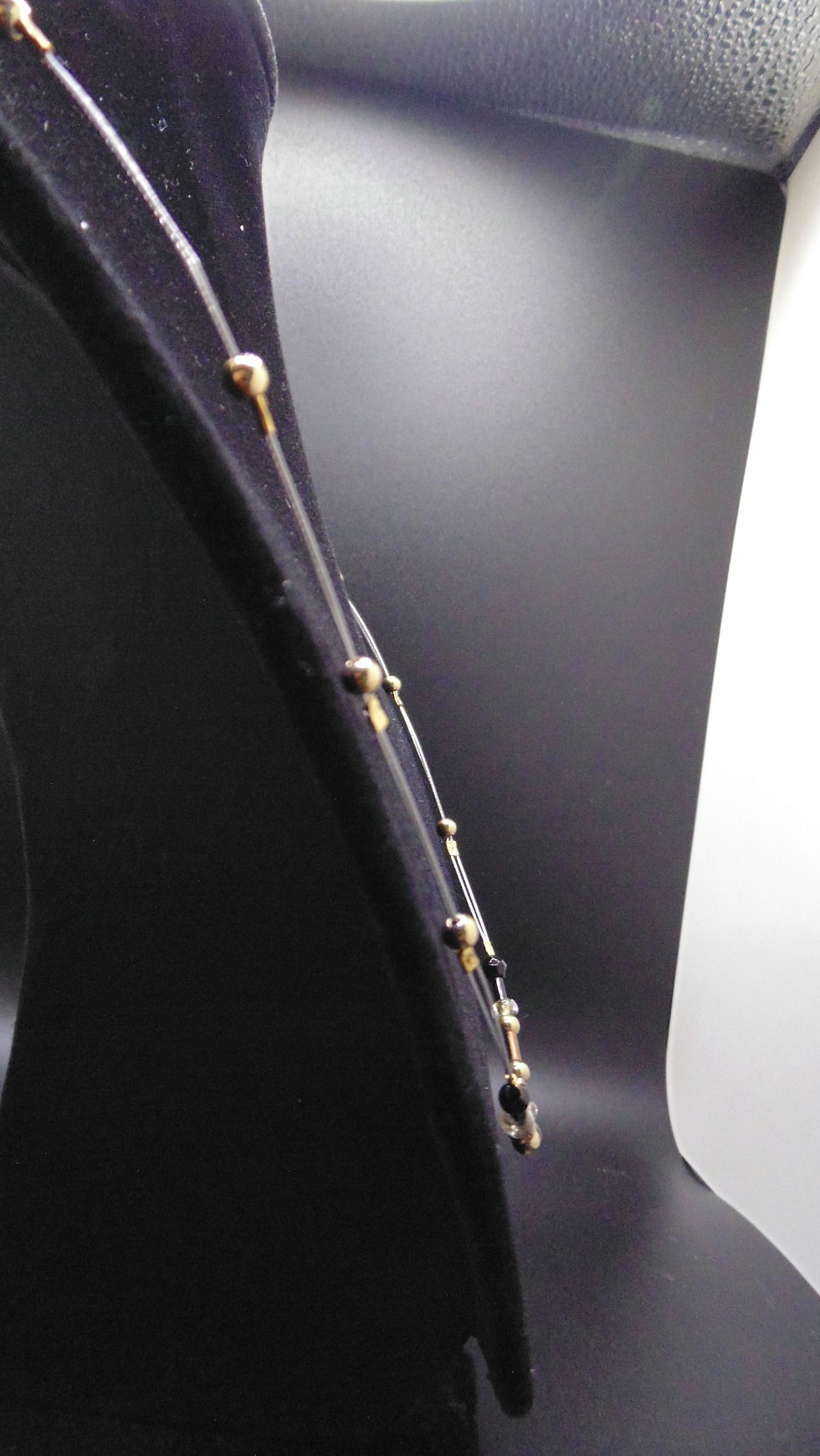 Thumbnail: Elegant beaded necklace on display