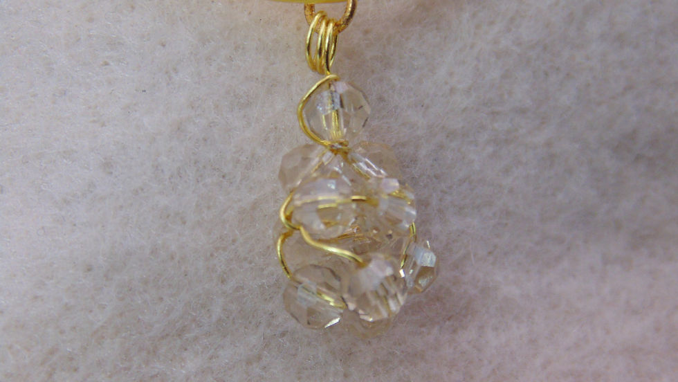 Thumbnail: Elegant gold wire-wrapped crystal pendant