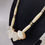 Thumbnail: Elegant bone and gemstone necklace