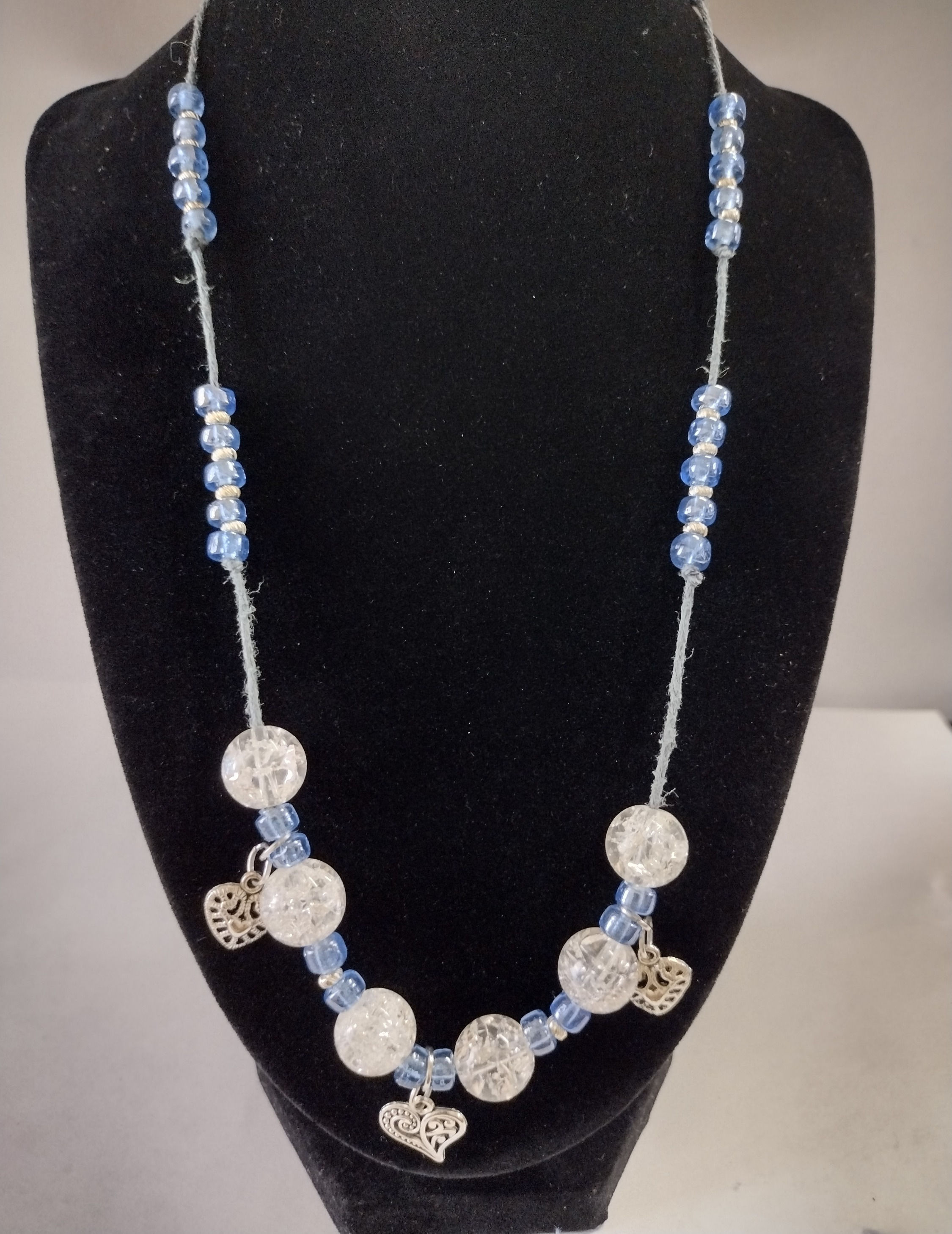 Elegant beaded necklace with silver heart accents