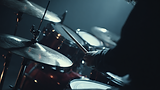 gergelfilm_close-up_of_a_drum_kit_with_a_musician_playing_cinem_09530d09-03f7-47b1-9c6c-8f