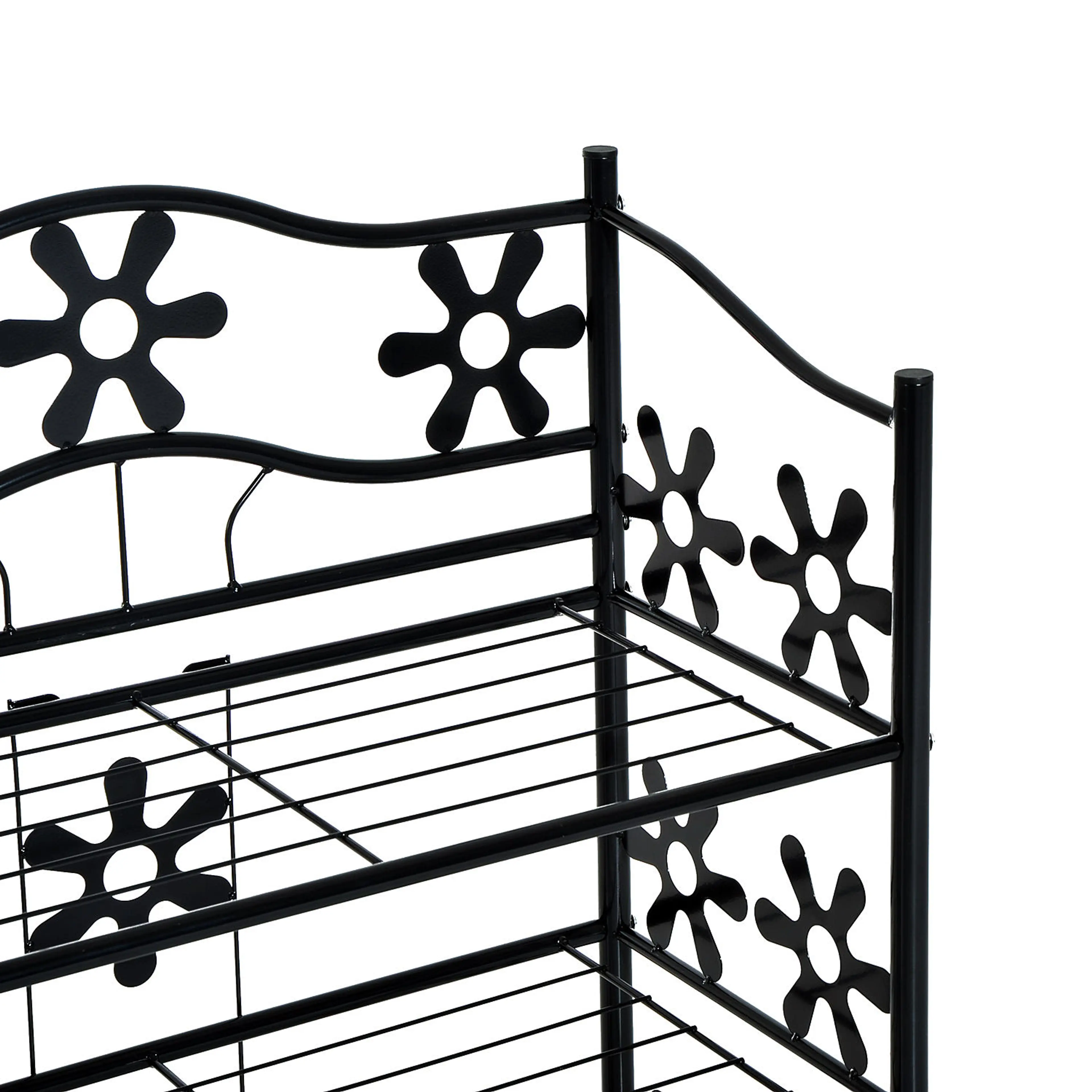 Närbild på hyllans överdel med blommor i svart metall