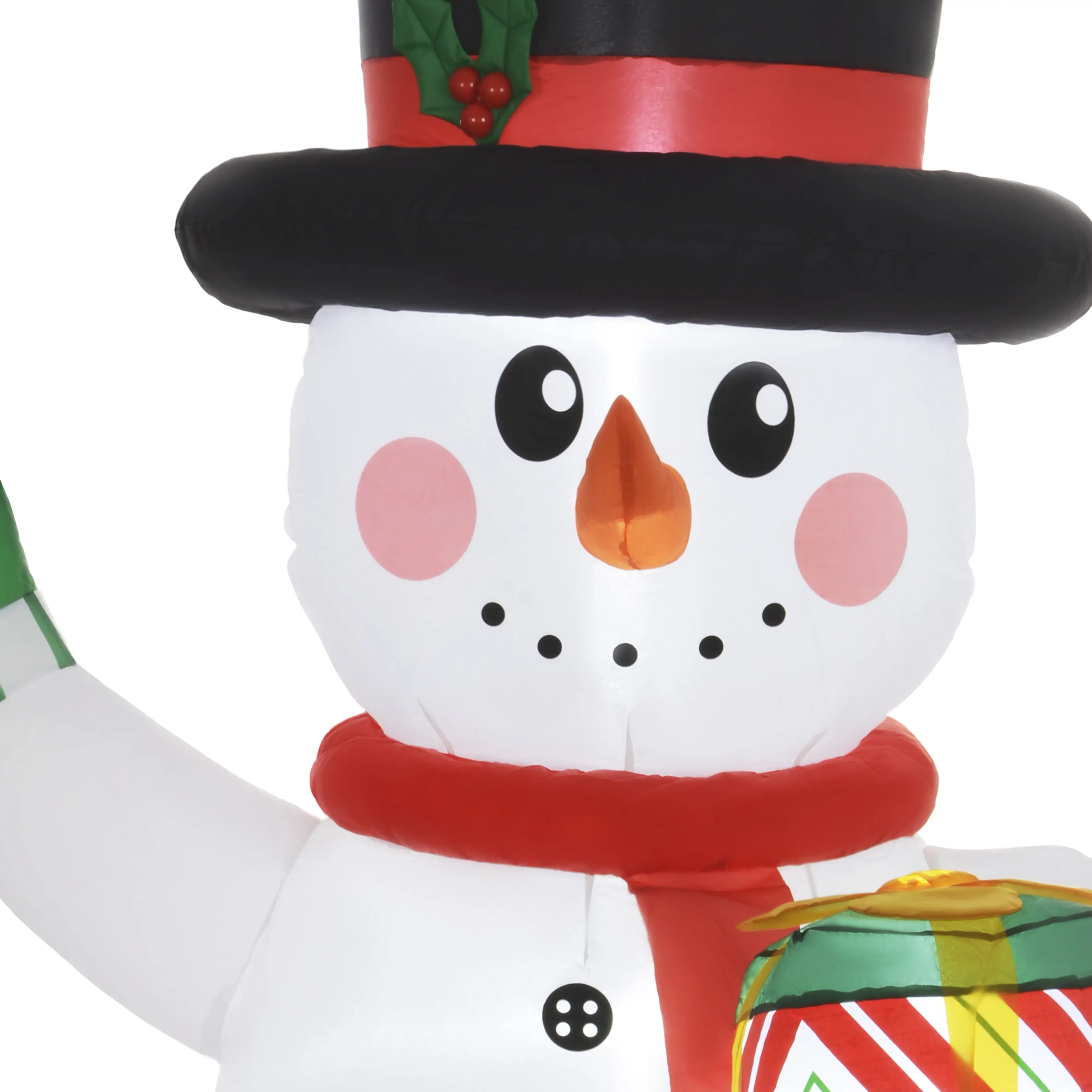 Närbild på snögubbens ansikte, hatt och röda halsduk