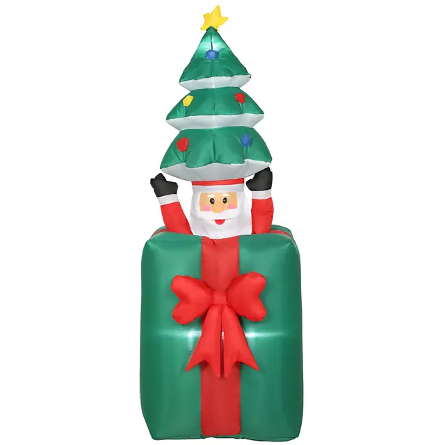 Uppblåsbar juldekoration där en tomte åker upp och ner ur ett grönt julklappspaket under en gran