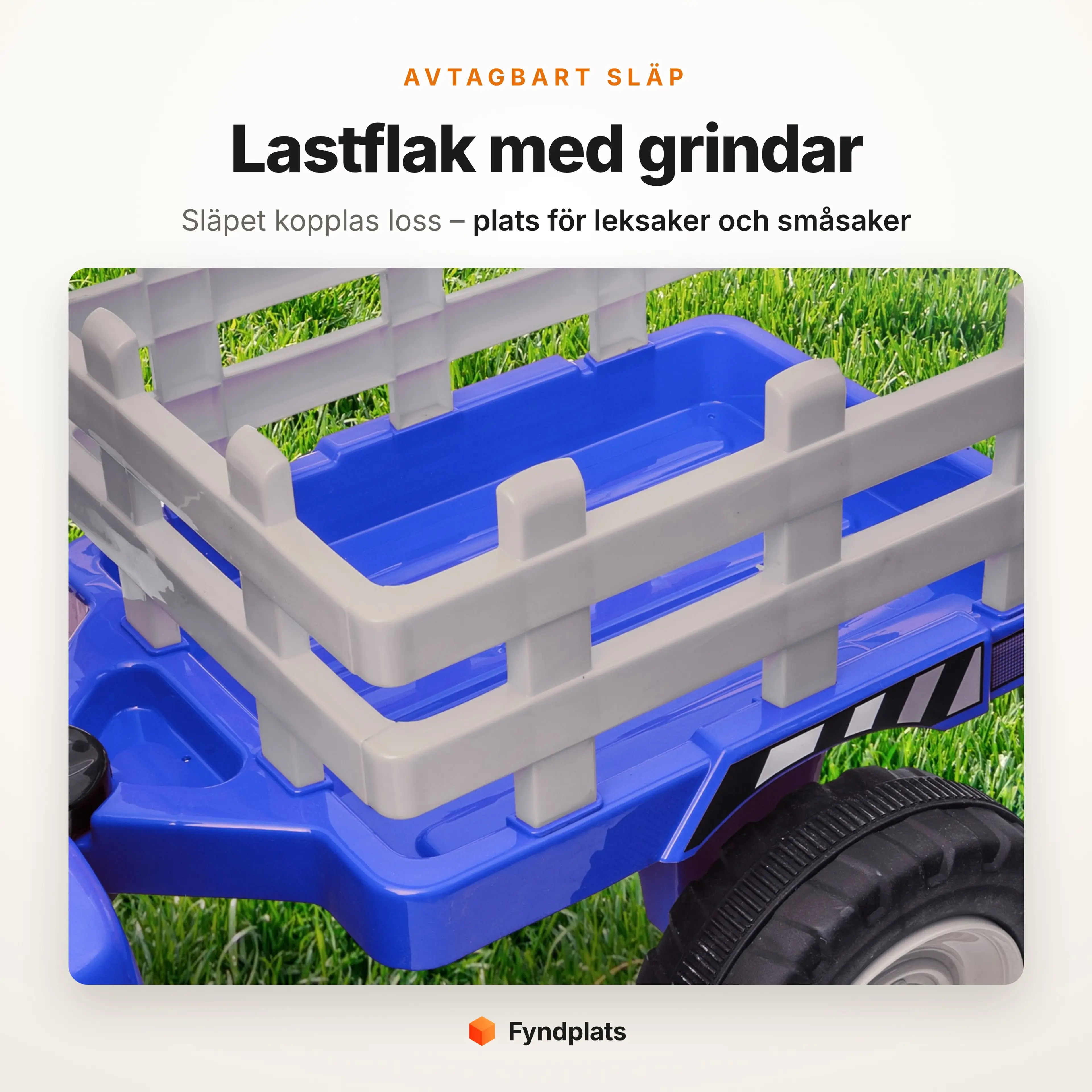 Avtagbart släp med grindar på eltraktorn, närbild på lastflaket i gräset
