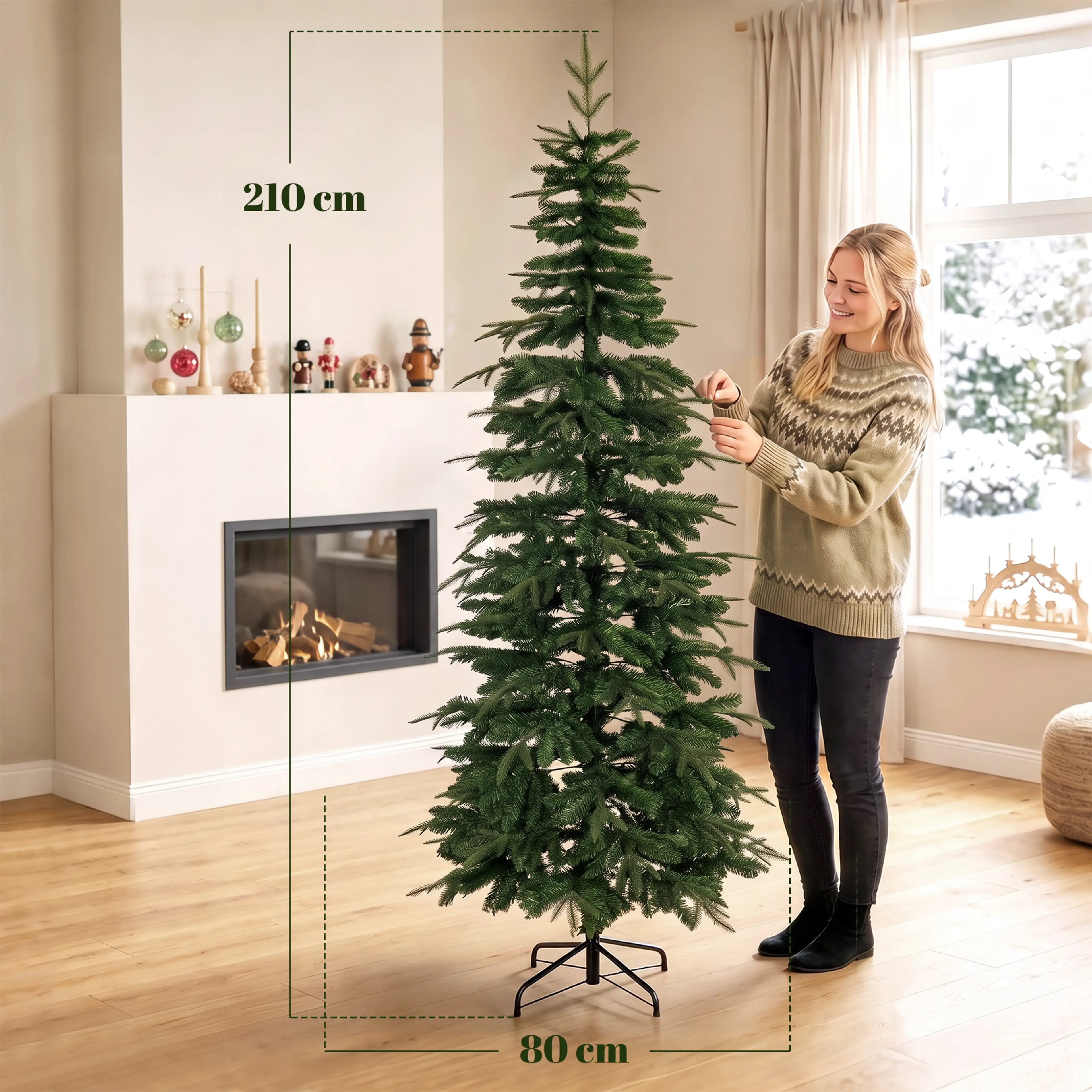 Måttbild: granen är 210 cm hög och 80 cm bred, med en kvinna som formar en gren