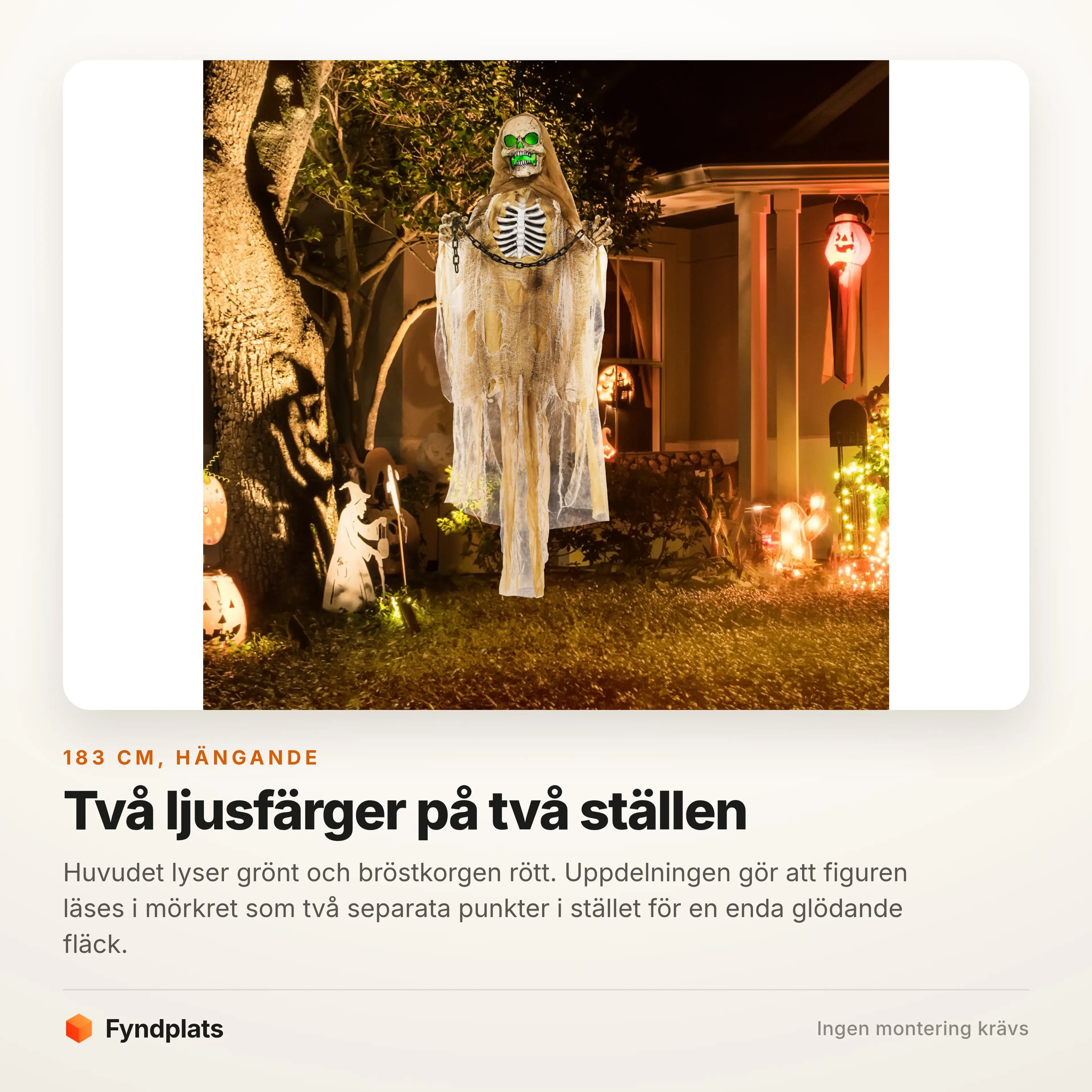 Figuren hänger tänd bland halloweenpynt