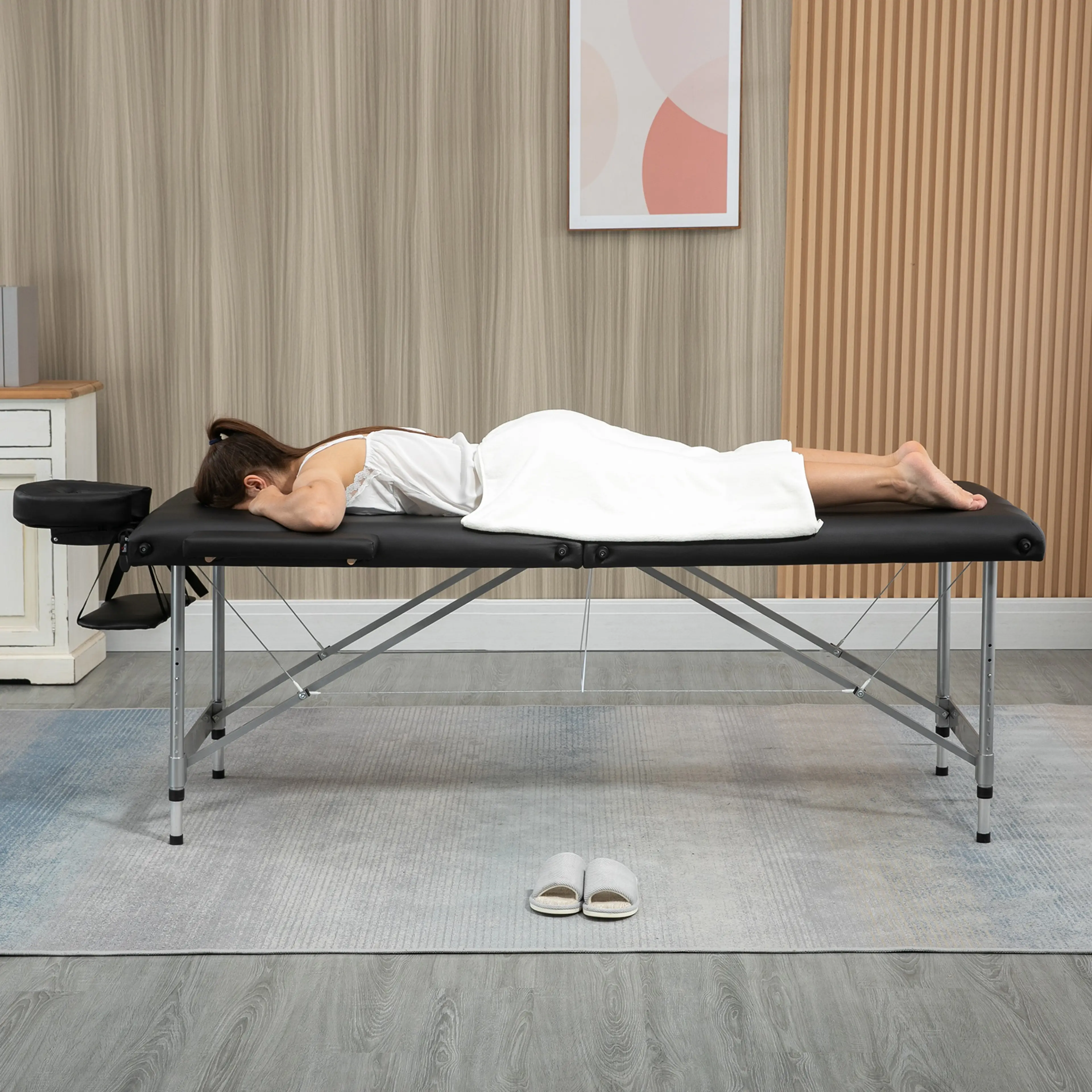 Svart hopfällbar massagebänk i aluminium med armstöd och handbrädor (2)