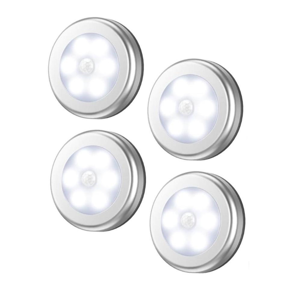 Liten vit trådlös LED-pucklampa med rörelsesensor på vägg