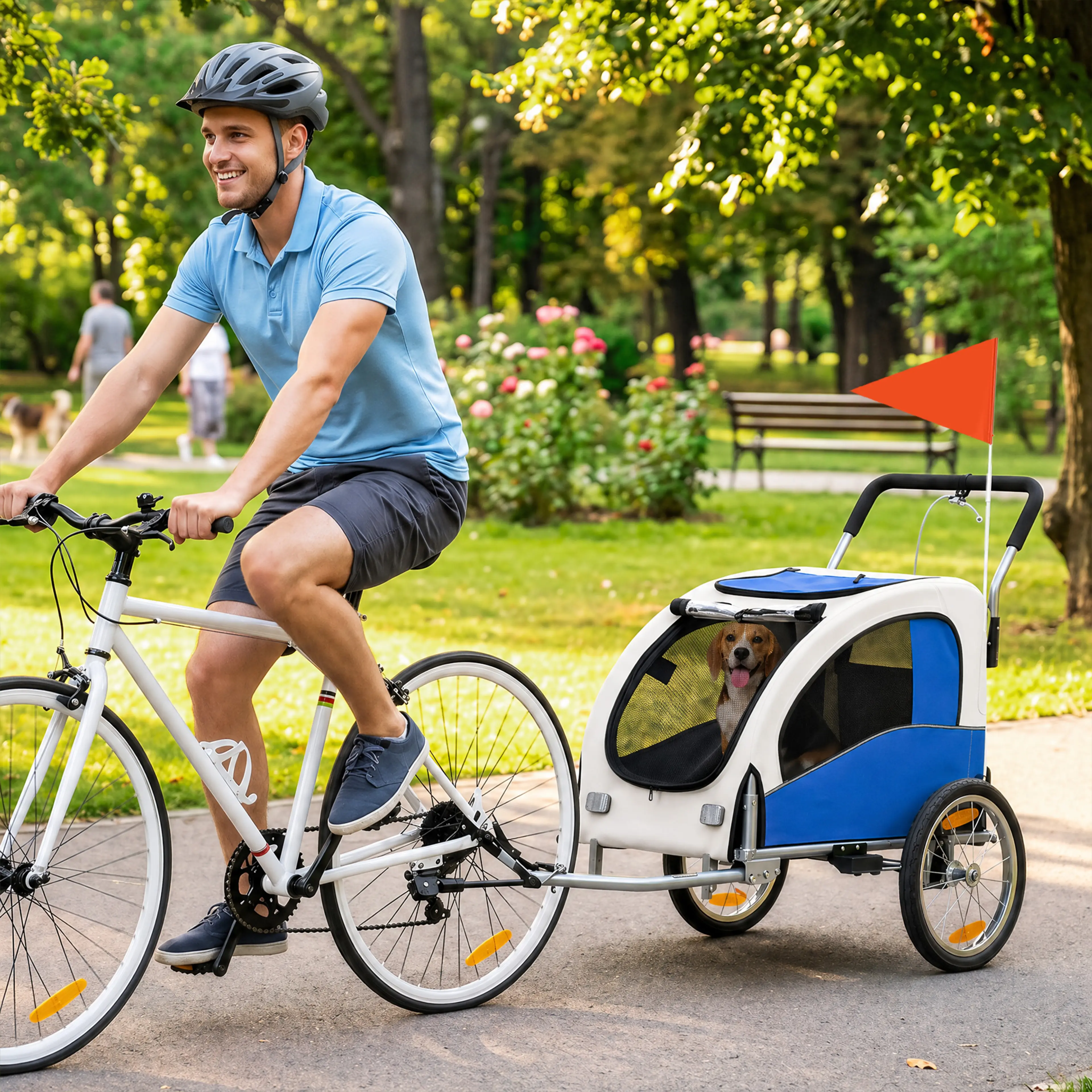En man cyklar i en park med en beagle i cykelvagnen bakom sig