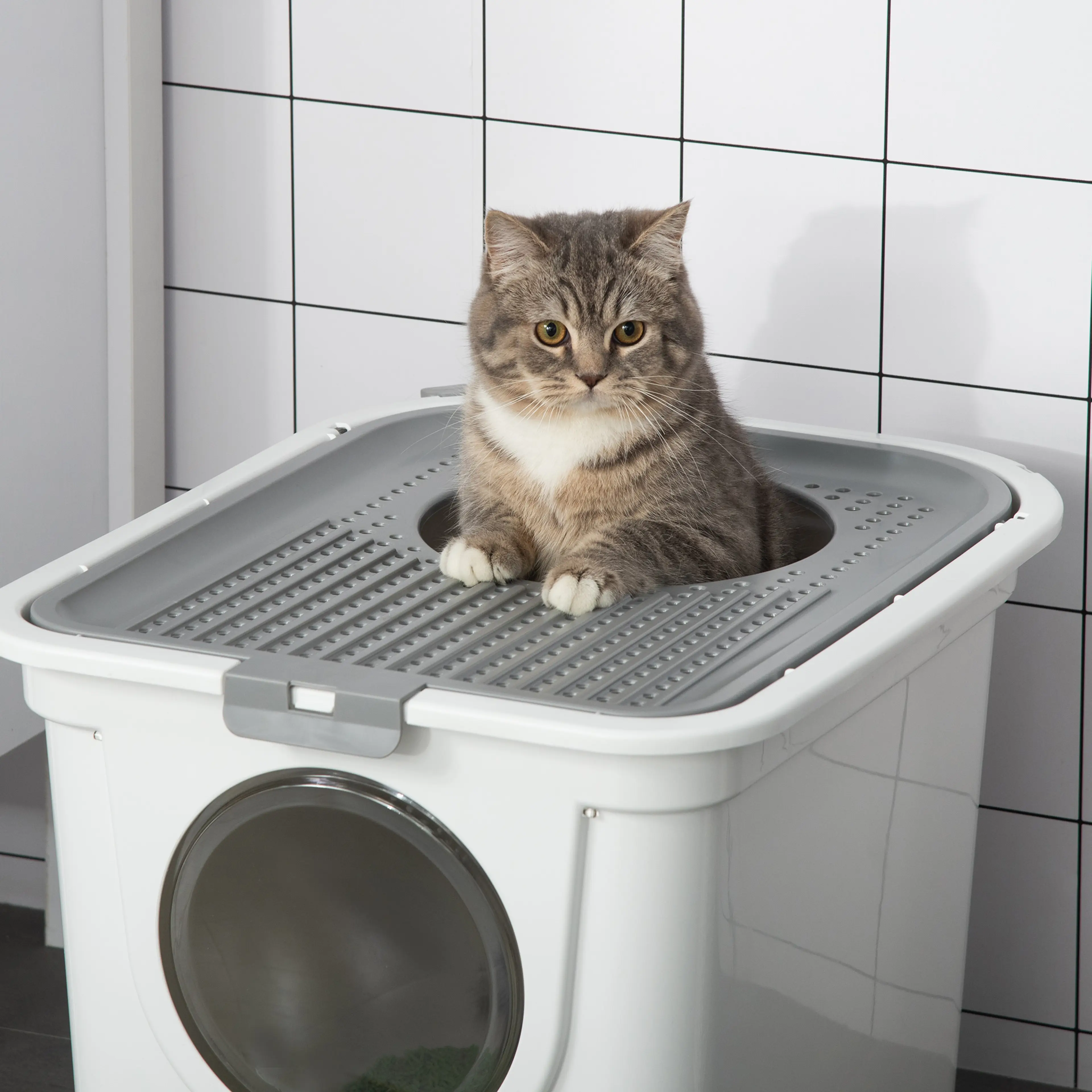 Närbild på det grå locket med ventilationshål och öppningen upptill