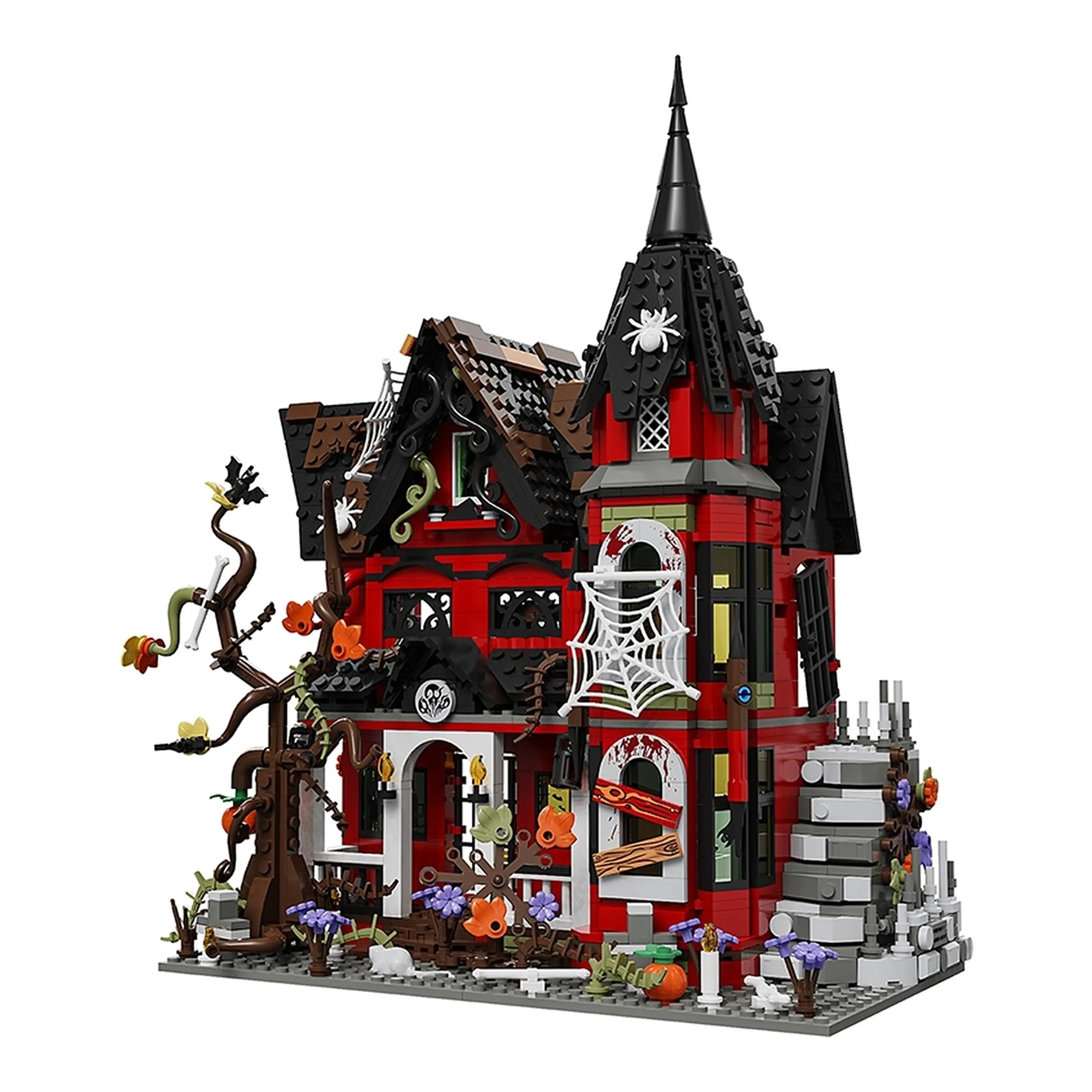 Spökhus byggsats i klossar – röd halloweenvilla med svart torn, spindelnät och gravgård mot vit bakgrund