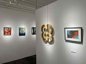 An exhibition scene at the 410 Gallery. Various artworks hang on the walls. 410 Gallery