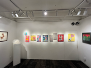 A painting exhibition, colorful artworks displayed on the walls. Art Gallery 410 Gallery. Enjoy art under bright lighting.