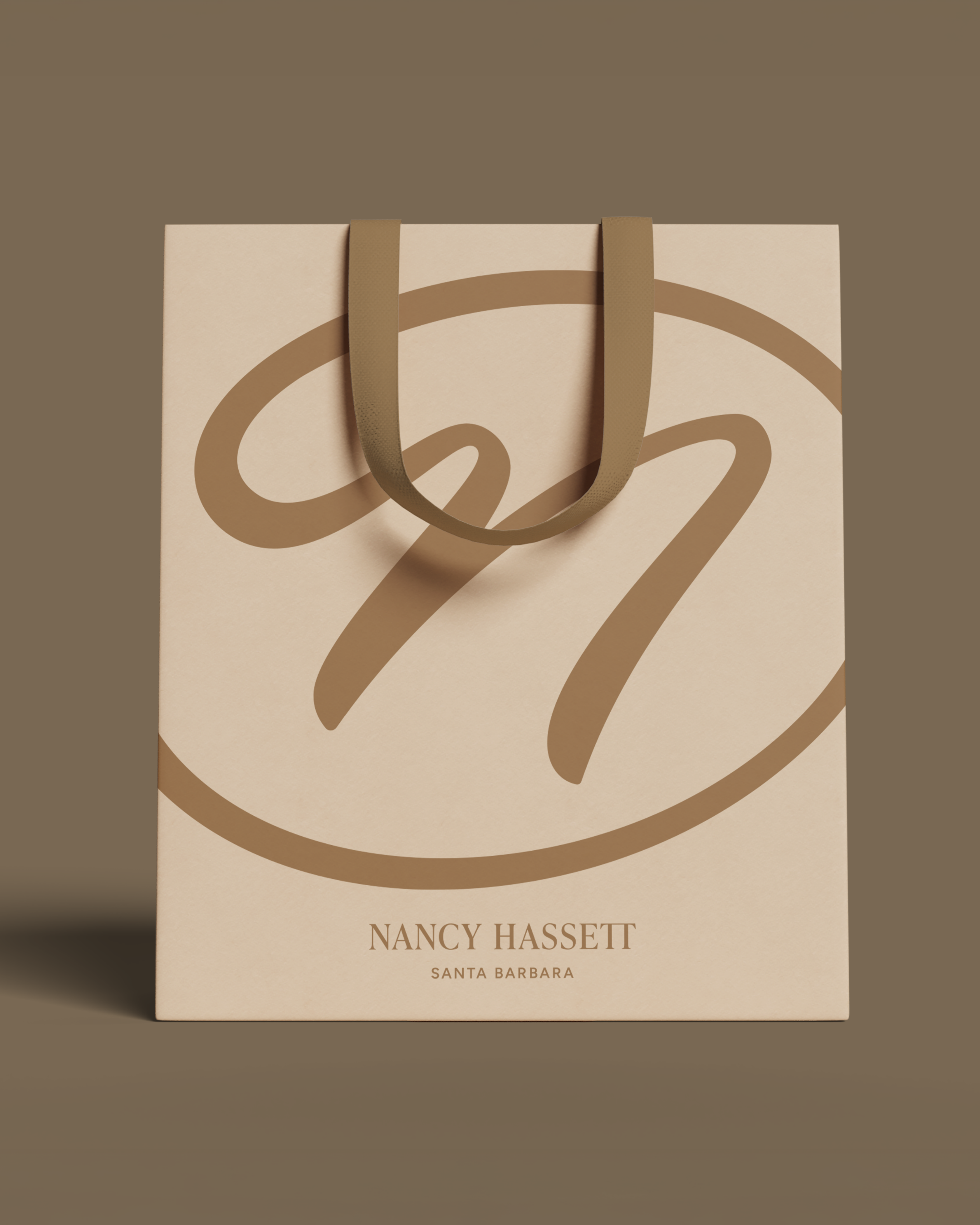 Nancy Hassett cream and gold shopping bag with oversized monogram