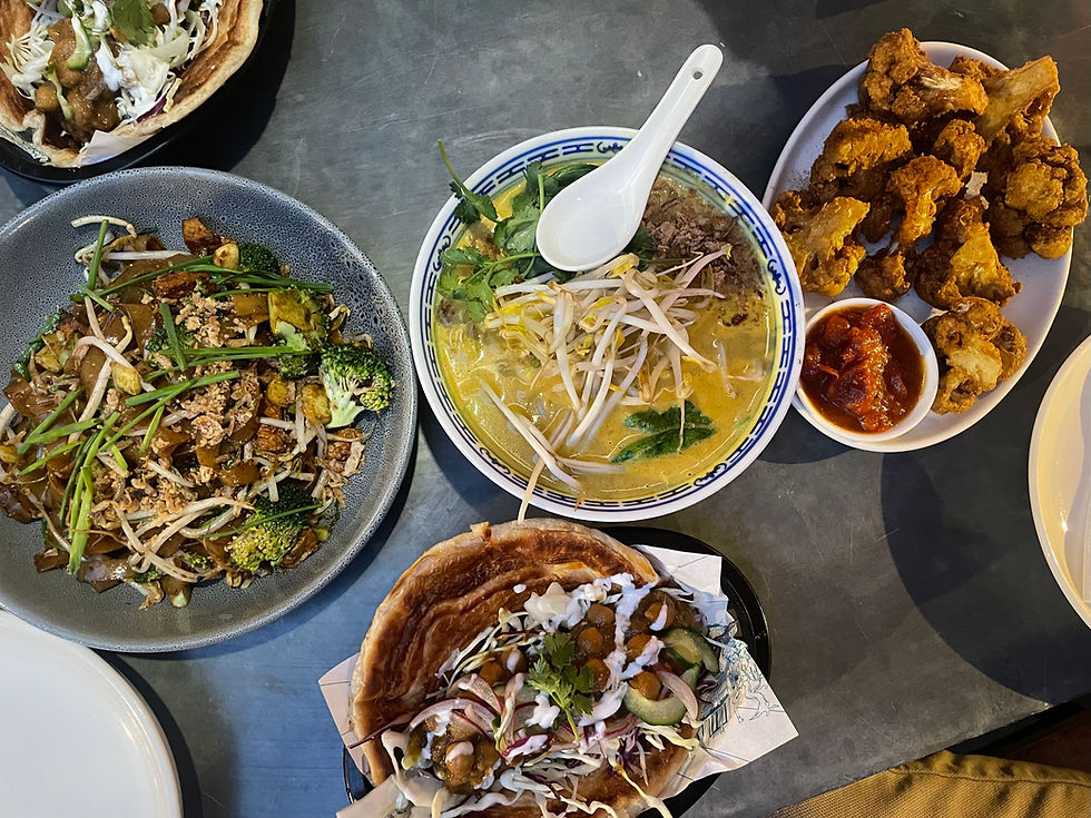 Dinner at Madam Woo: char kwey teow (left), laksa (center), spicy fried cauliflower (right), chickpea masala hawker roll (bottom)