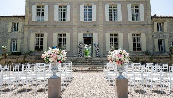 02-chateau-destinee-chateau-front-outdoor-ceremony-white-chairs-france