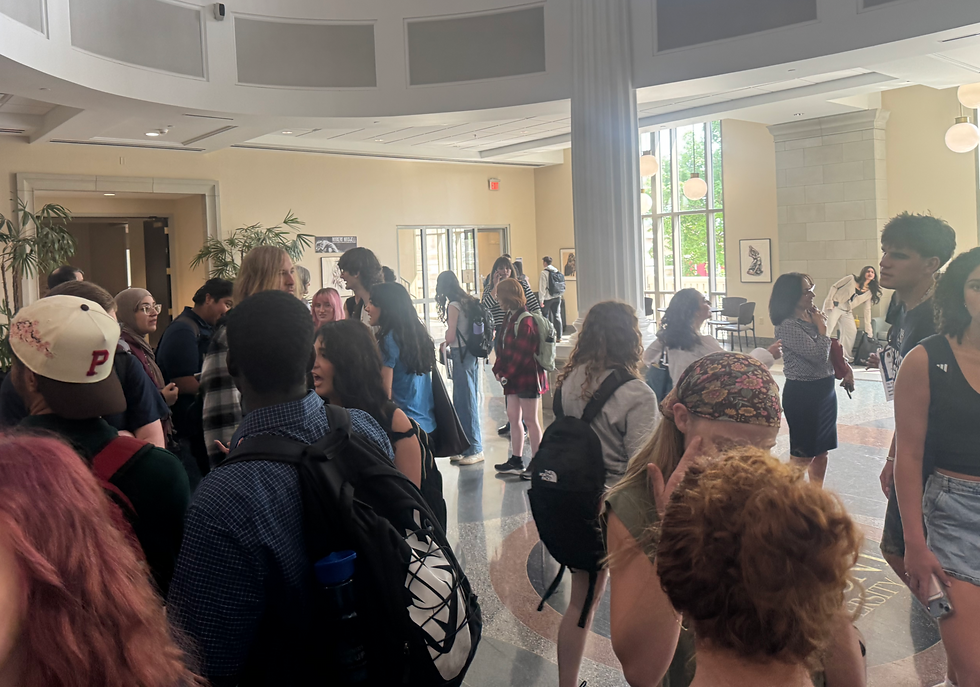 Students protesting outside the event filter out into the atrium. (Haley Ramsey)