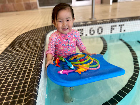 All smiles when you have a bunch of toys!