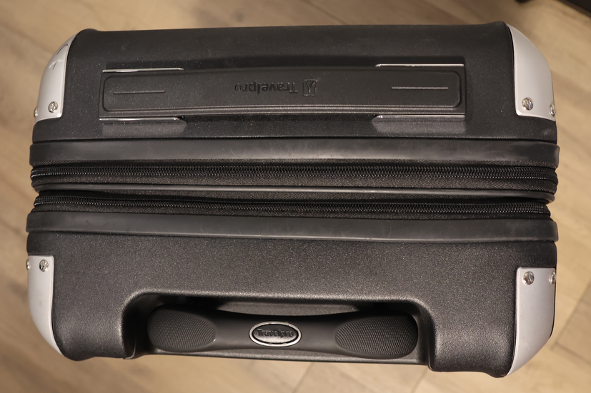 Top of a black Travelpro carryon suitcase with silver accents