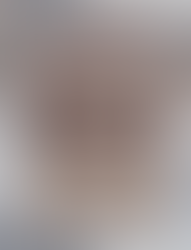 Blush pink cosemtic bag sitting on a counter with the front pocket open displaying an interior pocket and make up brush sleeves