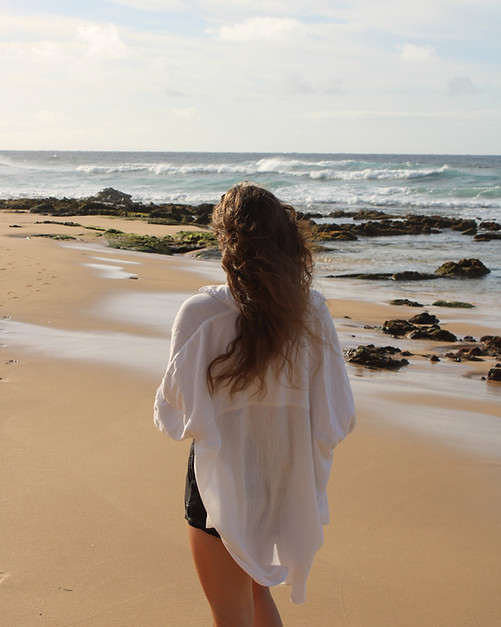 Woman taking a stroll along the beach
