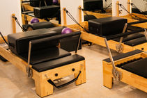 Eye-level view of Pilates reformer machine in a bright Abuja studio
