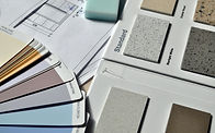 Interior design finish samples, material swatches, and floor plan documents used for residential design planning.