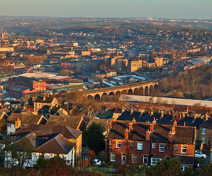 aerial-shot-of-a-small-town-in-england-with-old-bu-2023-11-27-05-05-46-utc_edited.jpg