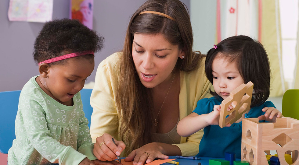 Teacher with children in a child care centre