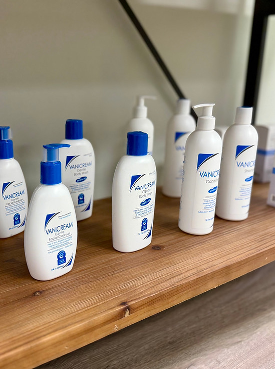 Skin care products on a modern wooden shelf display