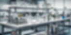 stainless steel table in a science lab with testing background.jpg