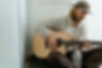 A man playing a guitar