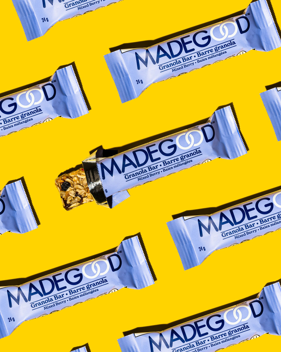 A product photograph of granola bars featuring a vibrant purple and yellow palette, enhancing their personality and bold design.