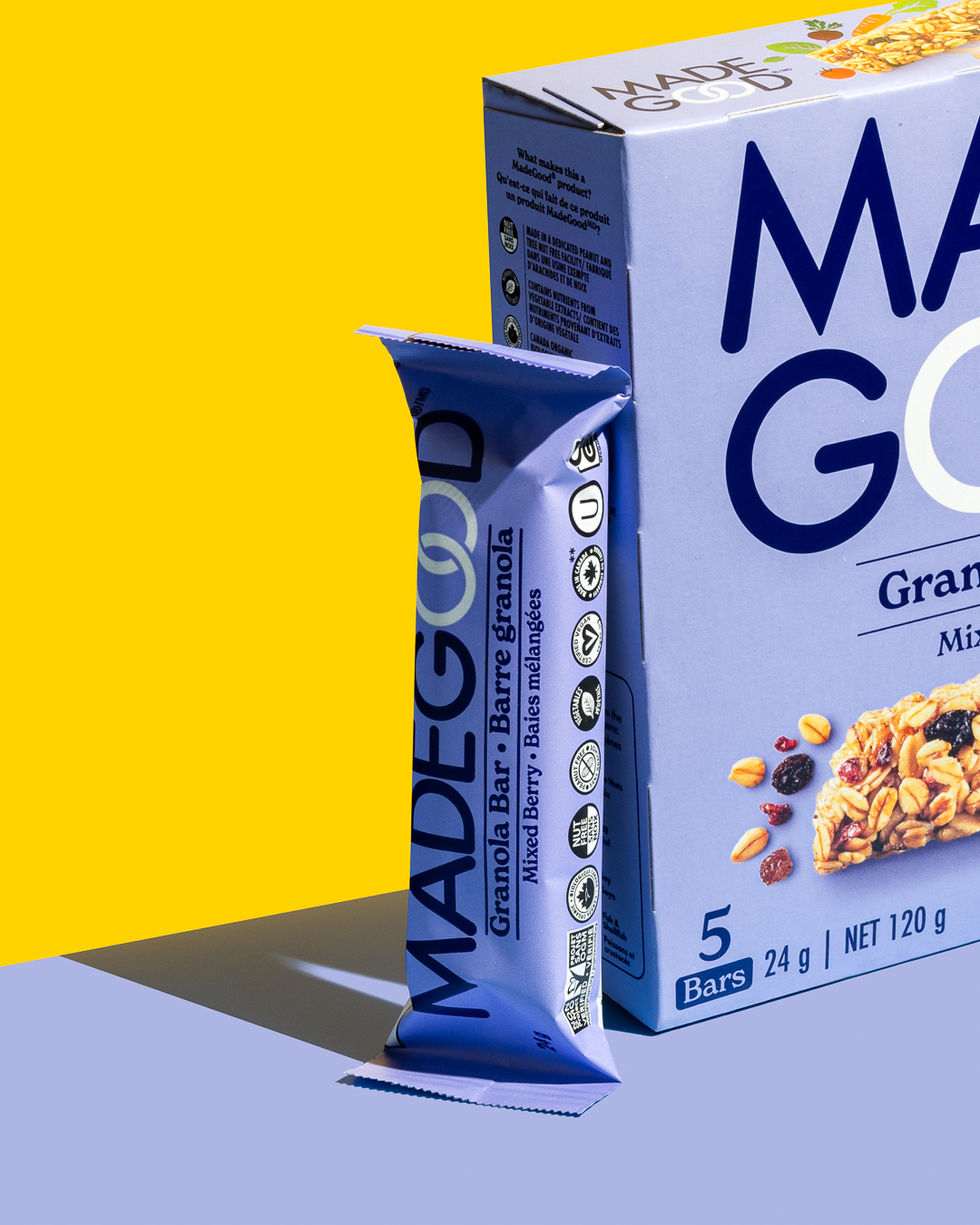 A product photograph of granola bars featuring a vibrant purple and yellow palette, enhancing their personality and bold design.