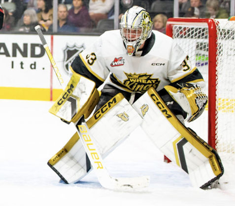 Brandon Wheat Kings of the WHL goalie Nick Jones set for a faceoff off the glove side of the net.