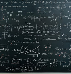 blackboard with complex math equations o