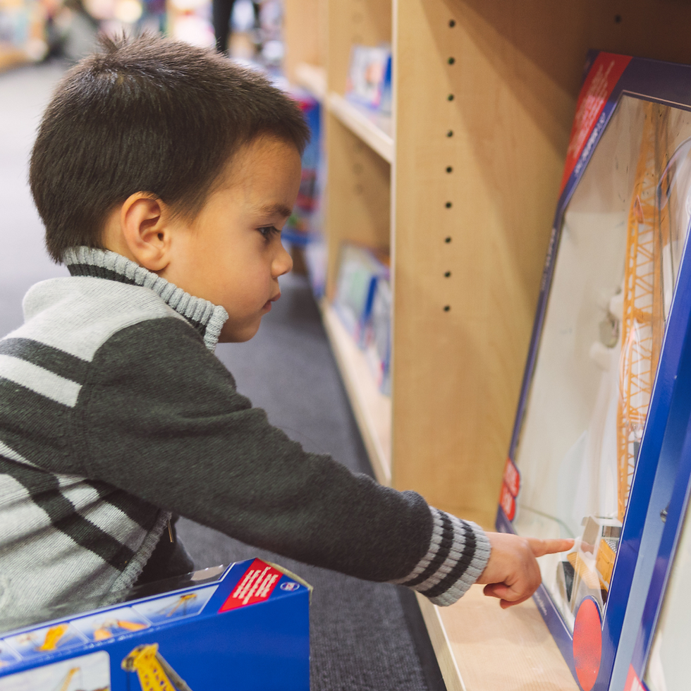 little boy playing with toys