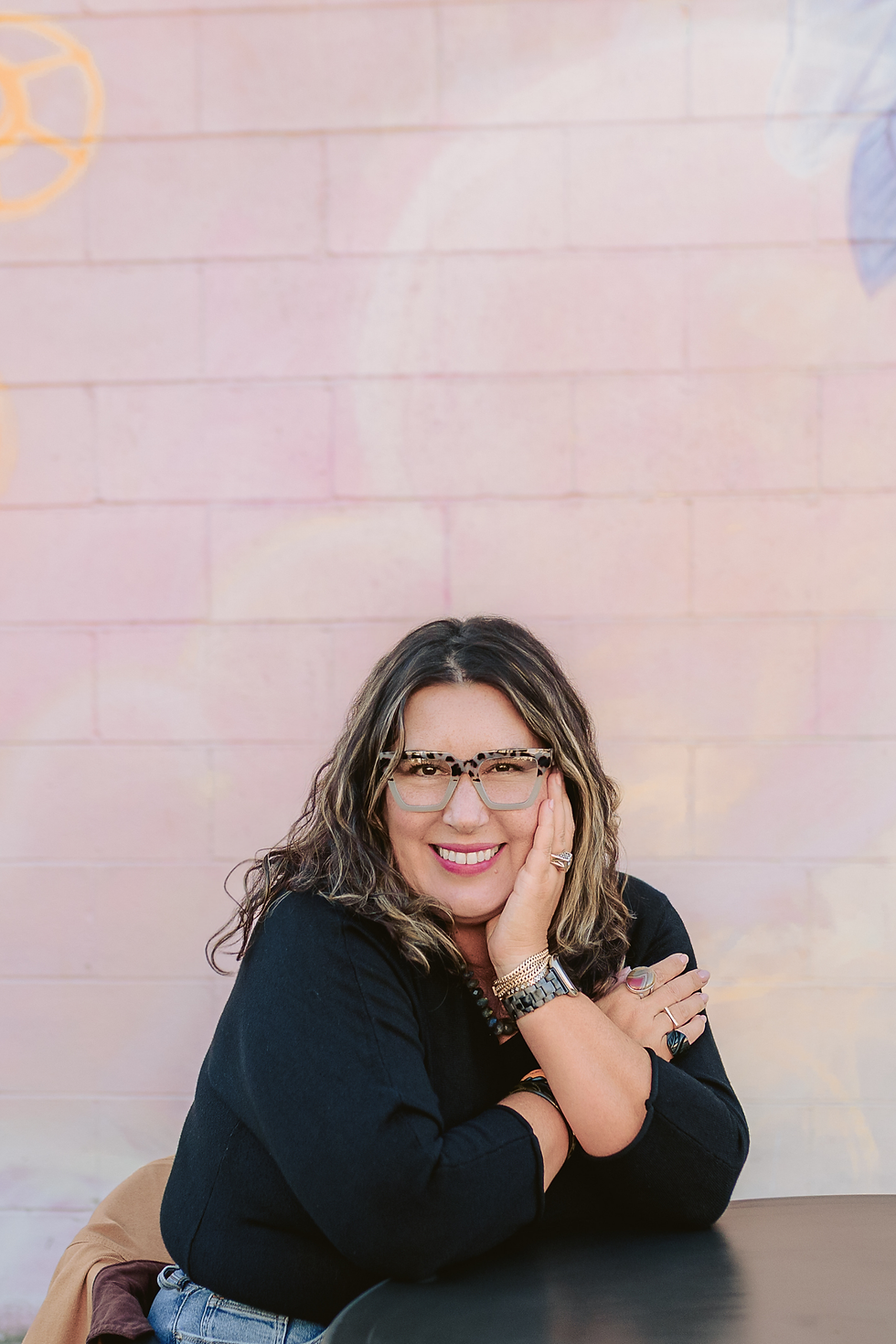 monika kunz career coach smiling with face in hand