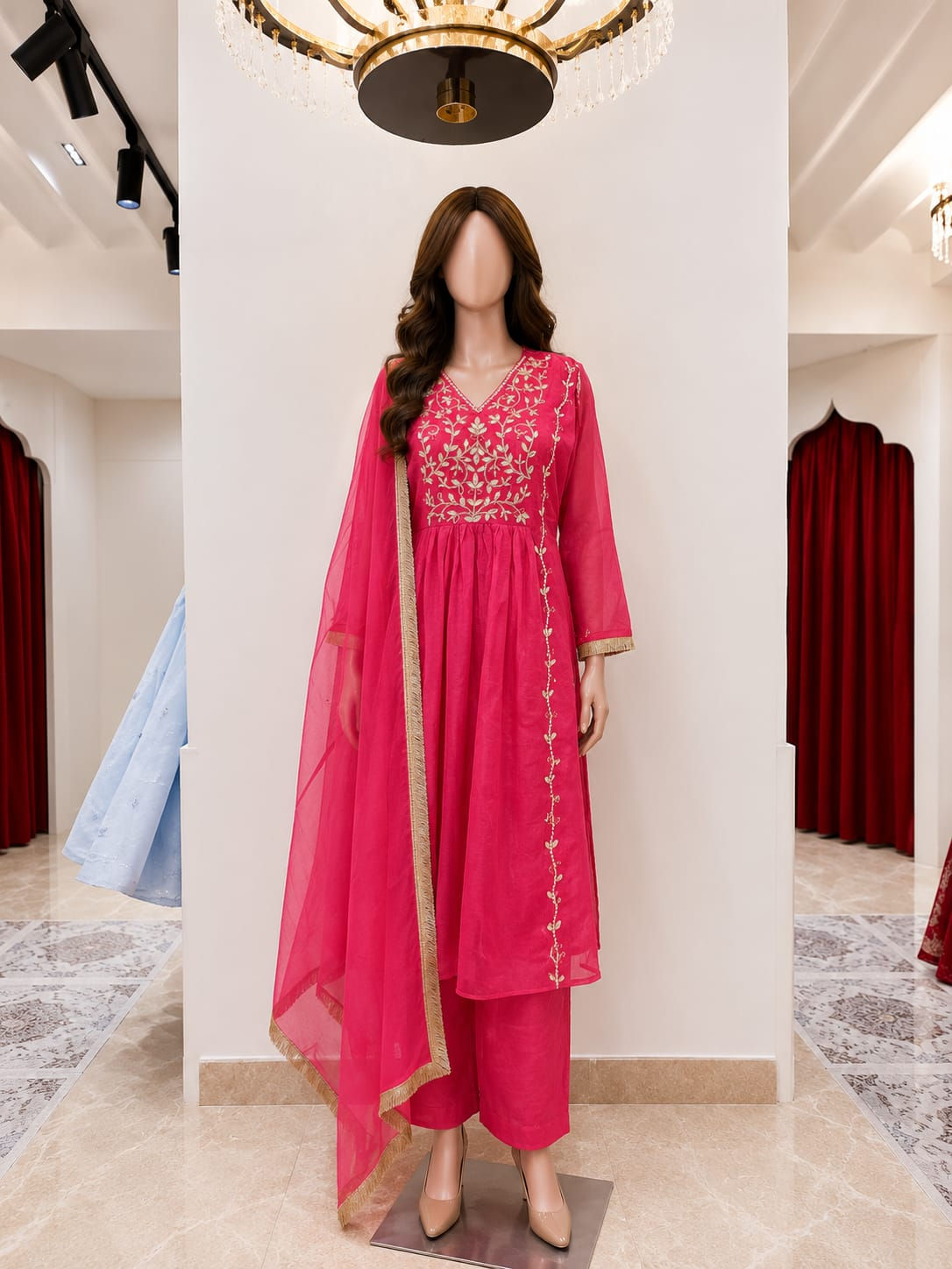 Elegant rani pink embroidered cotton frock kurti set for women featuring a flared kurti, matching pants, and dupatta.