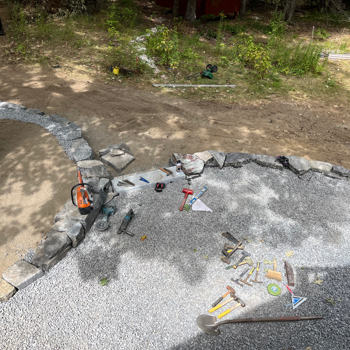 Flagstone Pathways, Chunk Granite Retaining Wall, Granite Step and Landing, River Round Sitting Area, and Arbor Bed with New Mulch. Newmarket, NH.