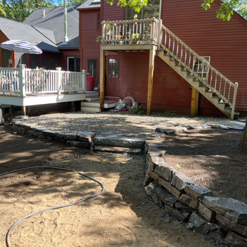 Flagstone Pathways, Chunk Granite Retaining Wall, Granite Step and Landing, River Round Sitting Area, and Arbor Bed with New Mulch. Newmarket, NH.