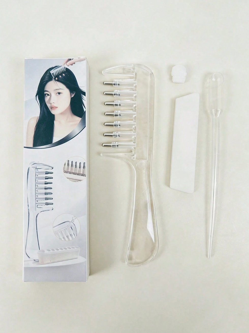 Thumbnail: The Scalp Glow Oil-Dispensing Comb