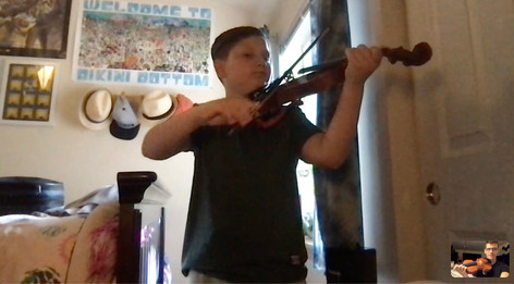 Connor Madsen teaches a violin lesson on FaceTime