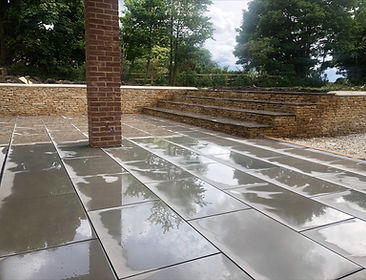 Extension completed as well as the landscaping including retaining dry stone wall and steps and limestone patio