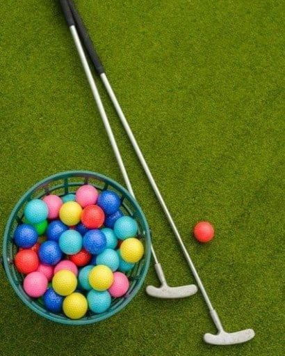 golf balls basket with putters.jpg